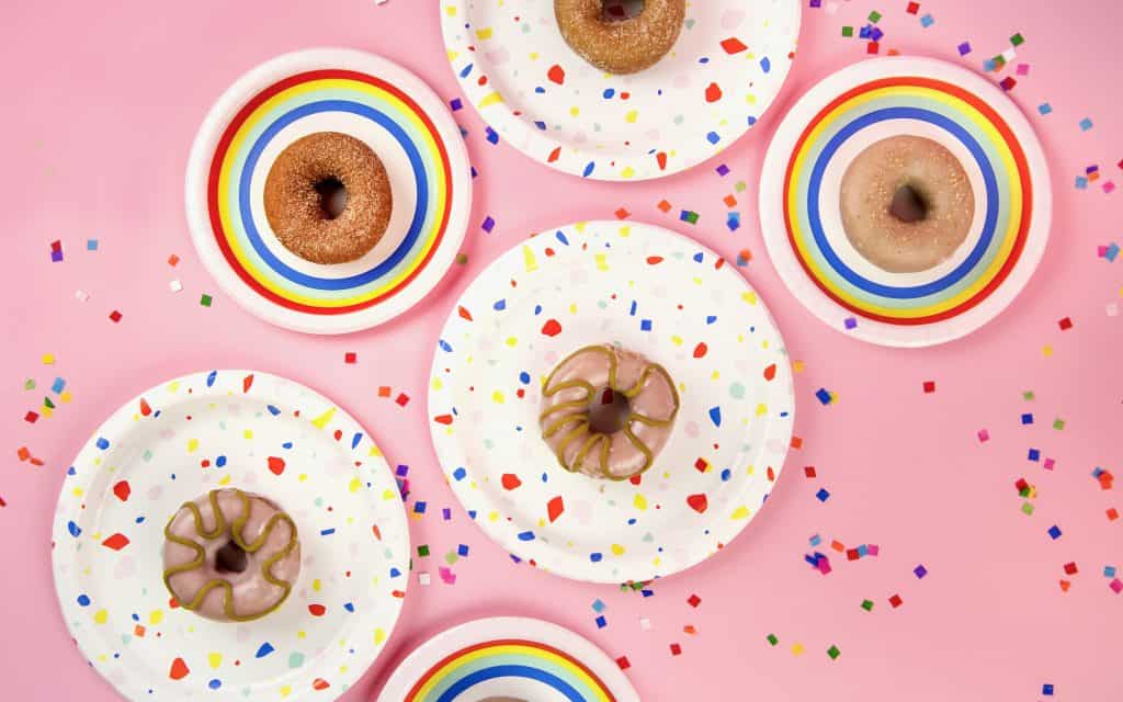 Flatlay image with donuts with frosting and confetti