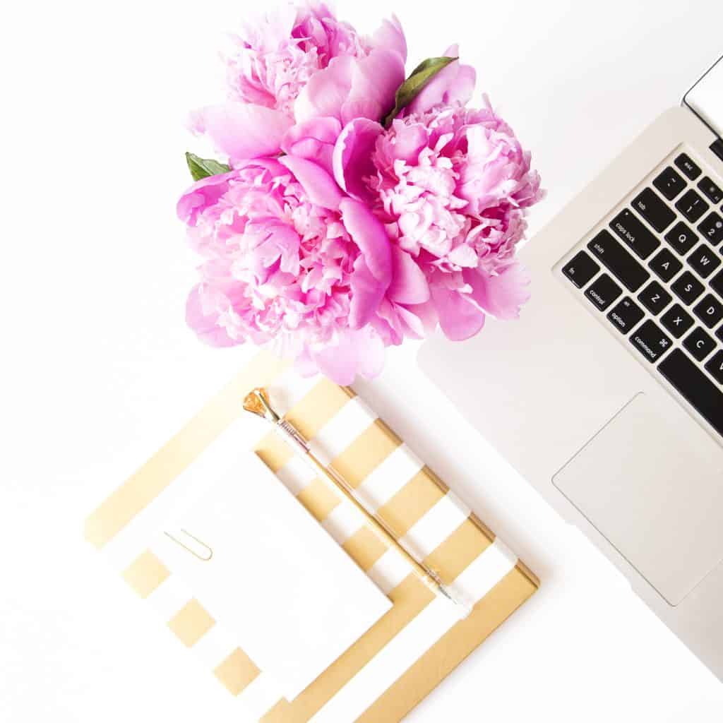 Laptop, peonies, and journals