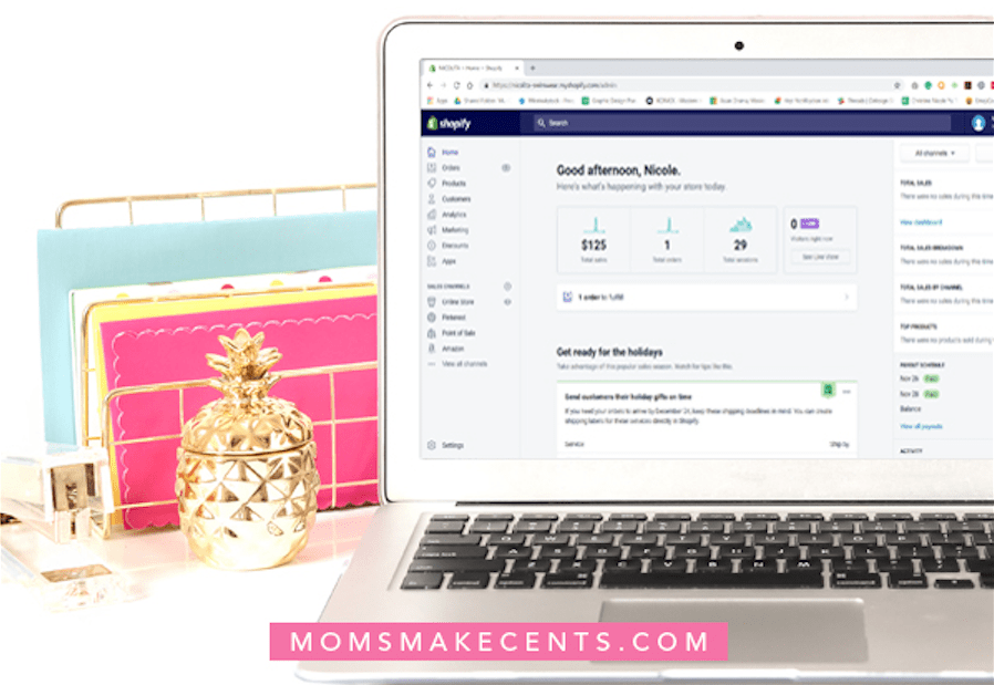 Laptop computer, folders, gold stapler and pineapple