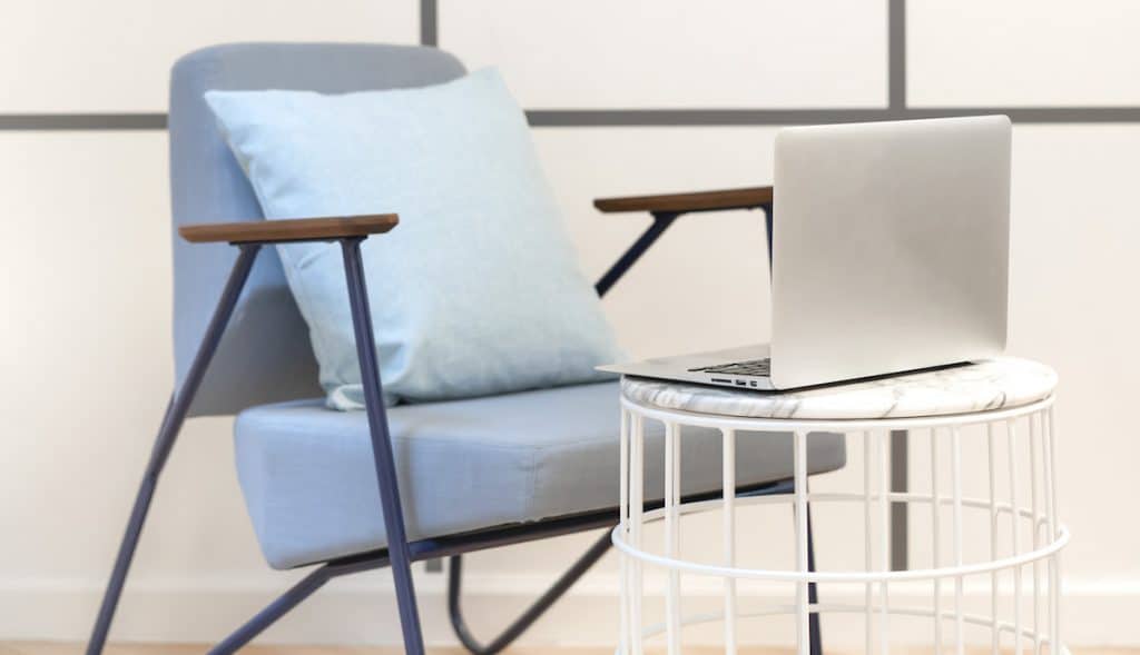 chair and desk with laptop