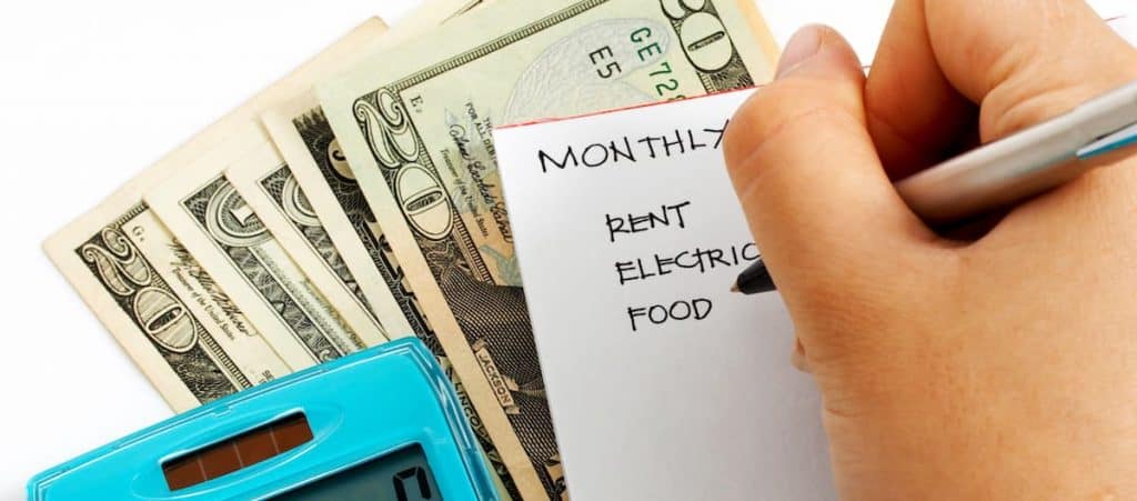 person calculating a budget as an example in biweekly budget article